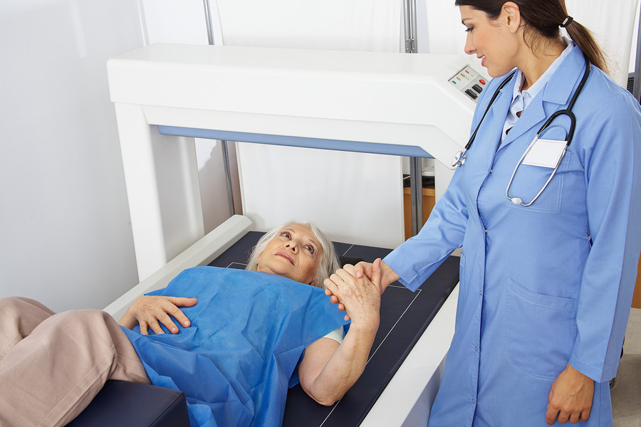 A doctor attending to a patient  Description automatically generated with medium confidence