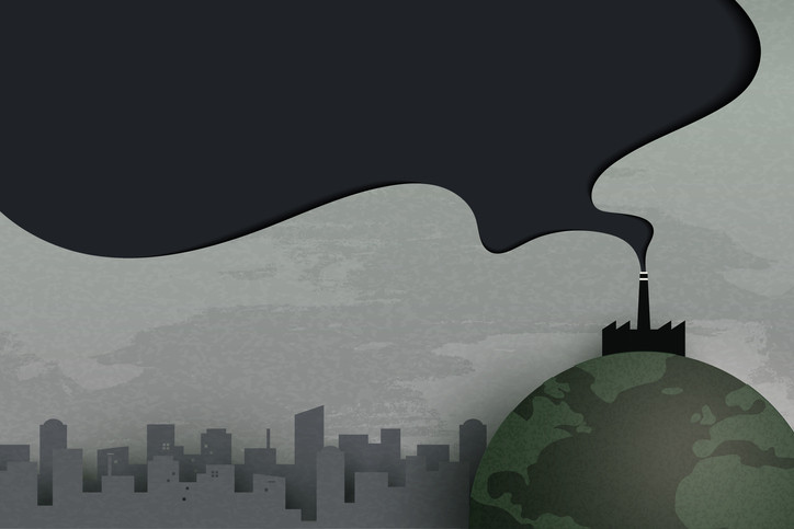 A hazy cityscape with the world in the foreground and a factory burning fossil fuels with a dark cloud of pollution rising into the sky
